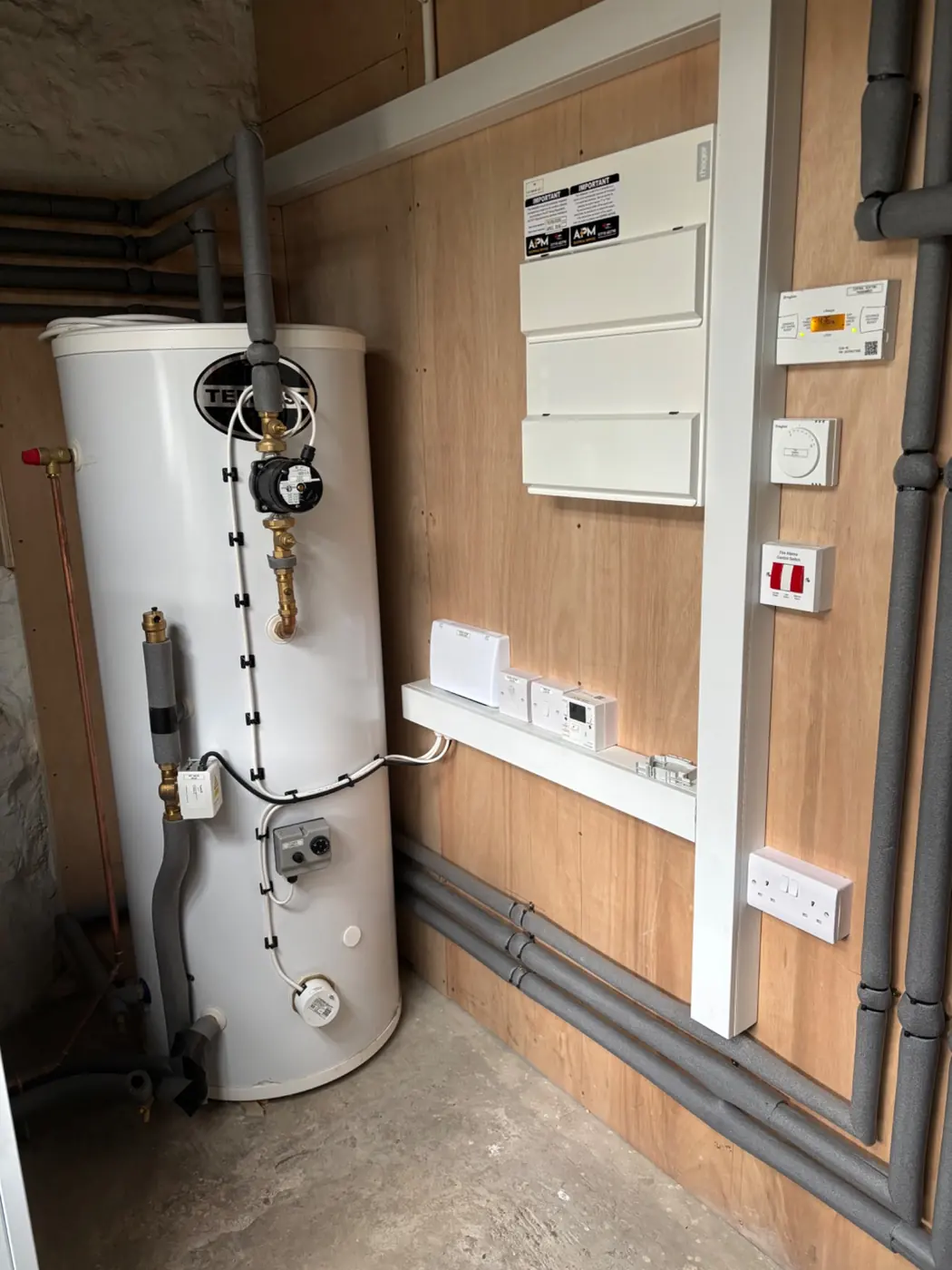 Completed consumer unit and electrical controls installation in a domestic plant room