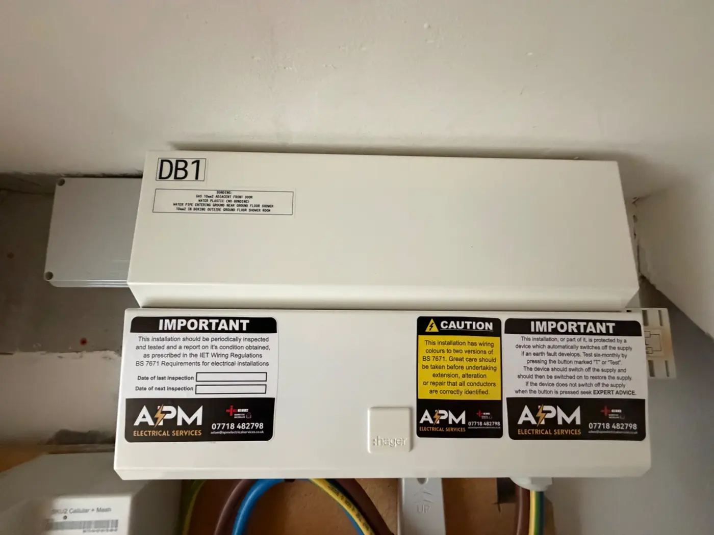 Completed Hager consumer unit installation with APM Electrical Services labels
